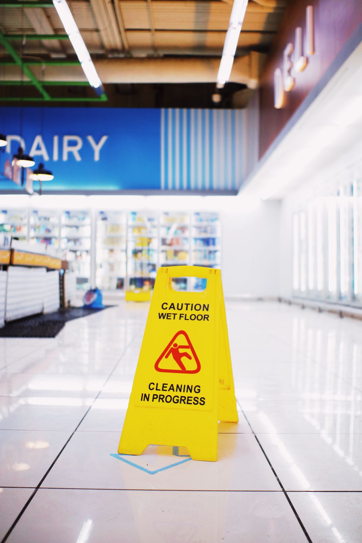 Yellow wet floor caution sign indicating a premises hazard